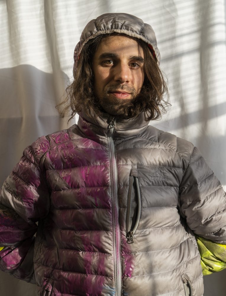 Portrait of Alex Kalil in a hand-dyed puffer jacket.